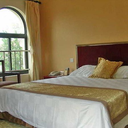 Regius Exhibition Hotel Шанхай Стая снимка